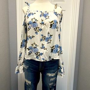 Floral printed cold shoulder fashion top .